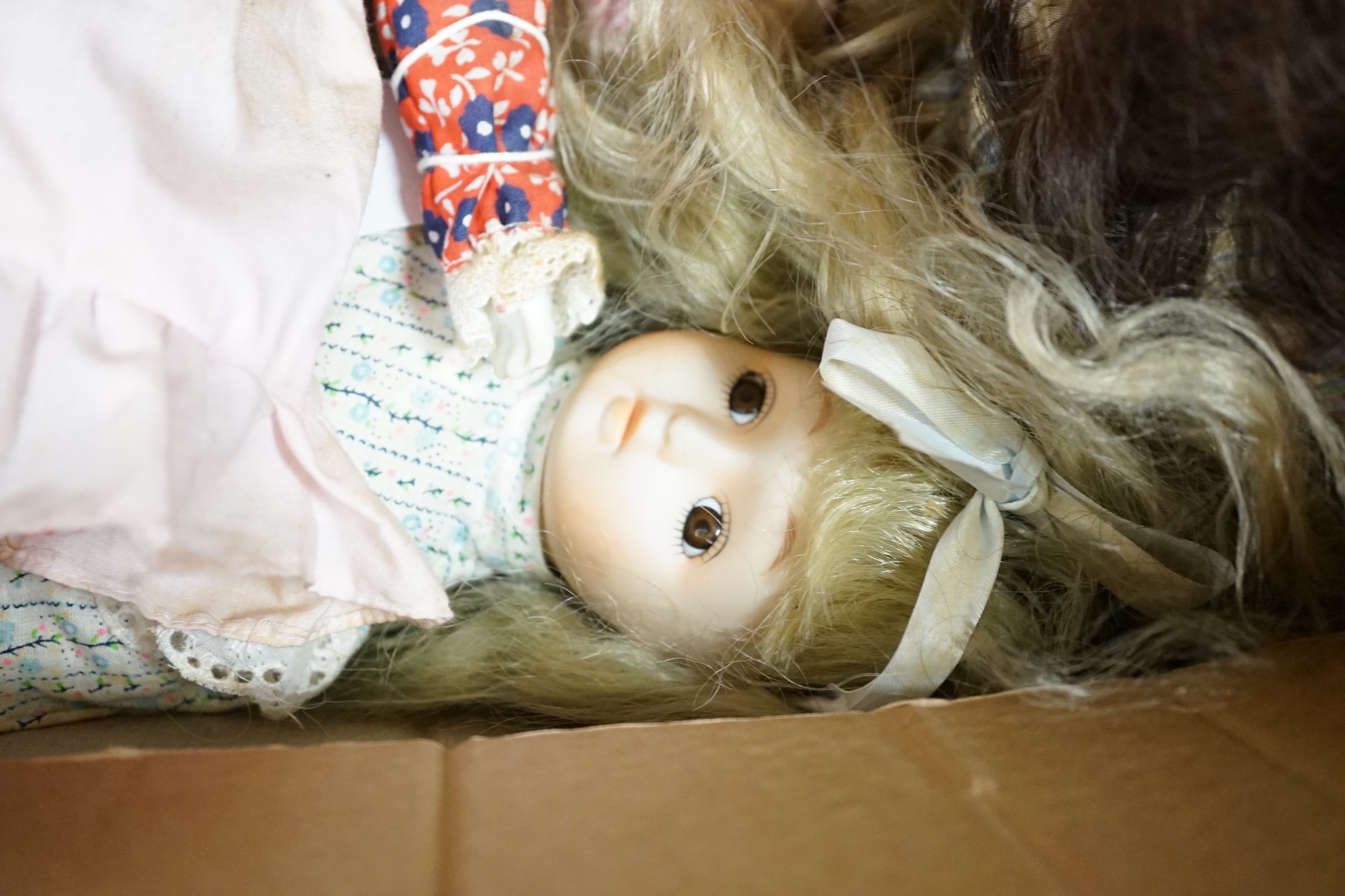 A quantity of various dolls